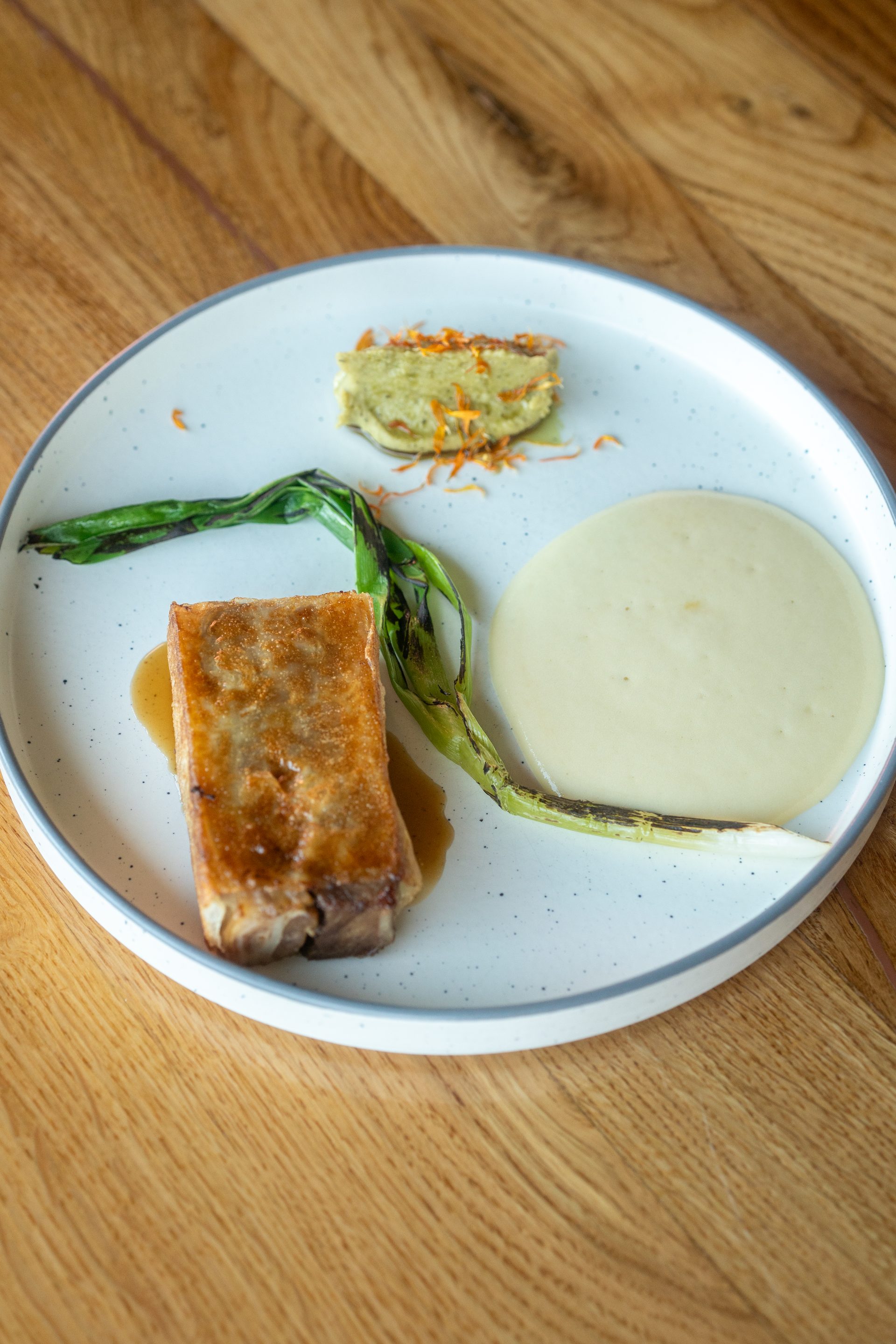 Slow roasted lamb pressed overnight, crisped in thin dough, pea and mint purée
