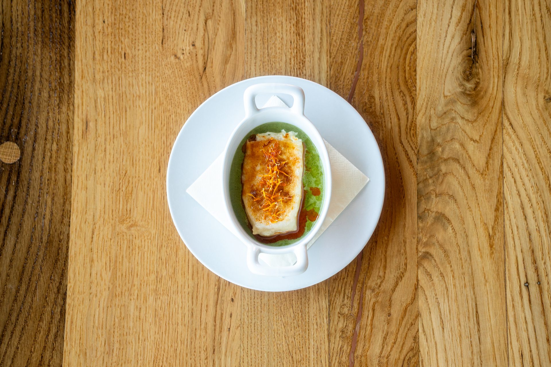 Štrukli — traditional Croatian cheese dumplings with wild garlic cream and brown butter