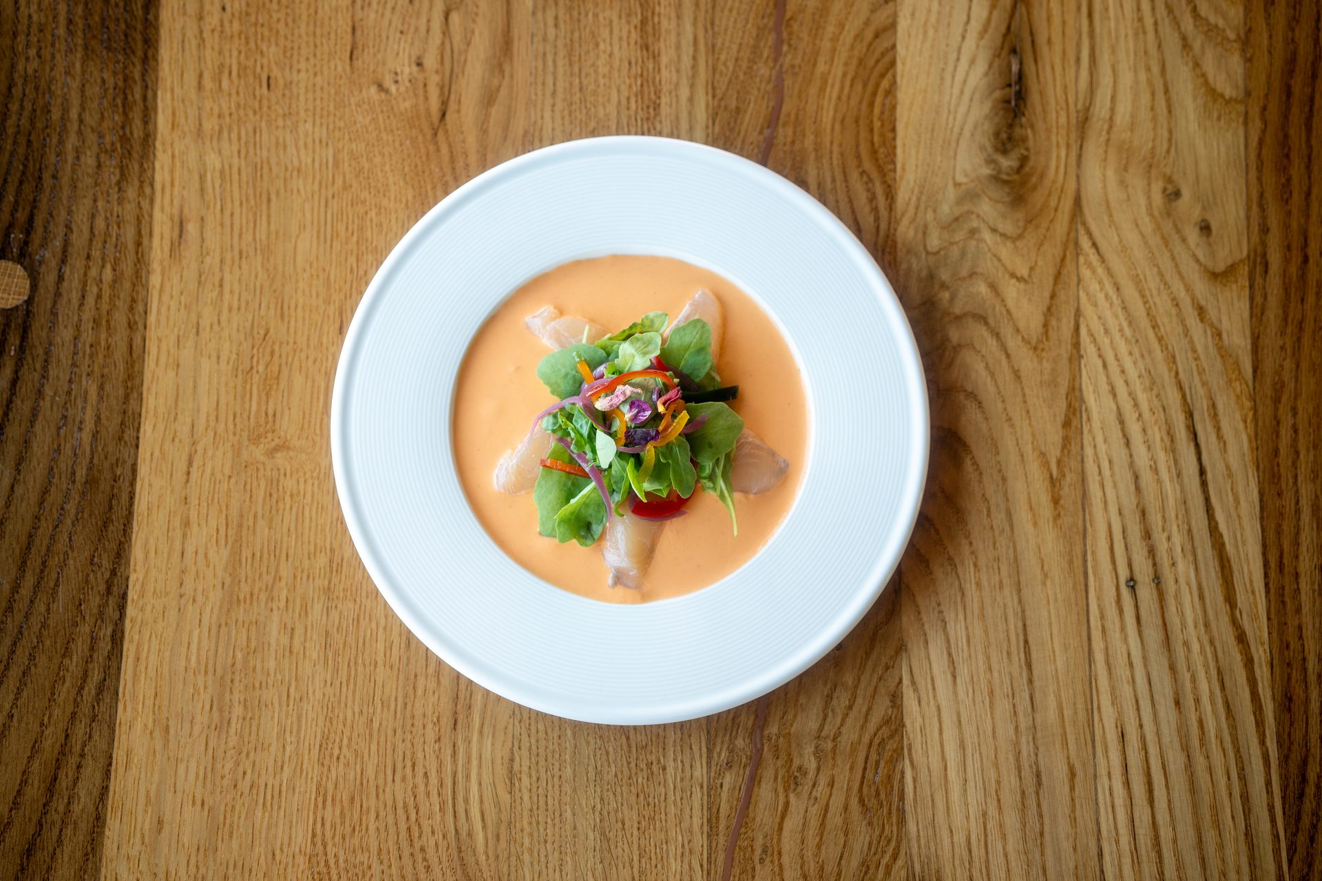 Marinated trout with citrus emulsion, pickled chillies and red onions