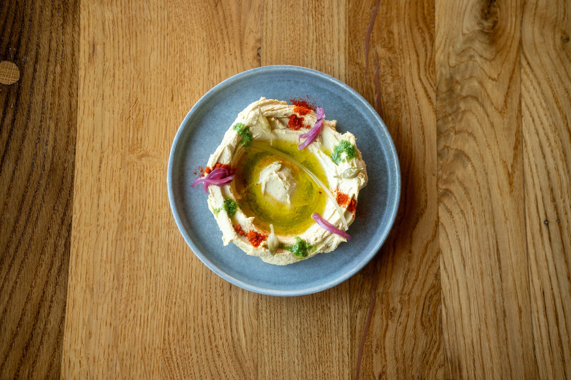 House hummus with wild garlic pesto, pickled red onion and paprika oil