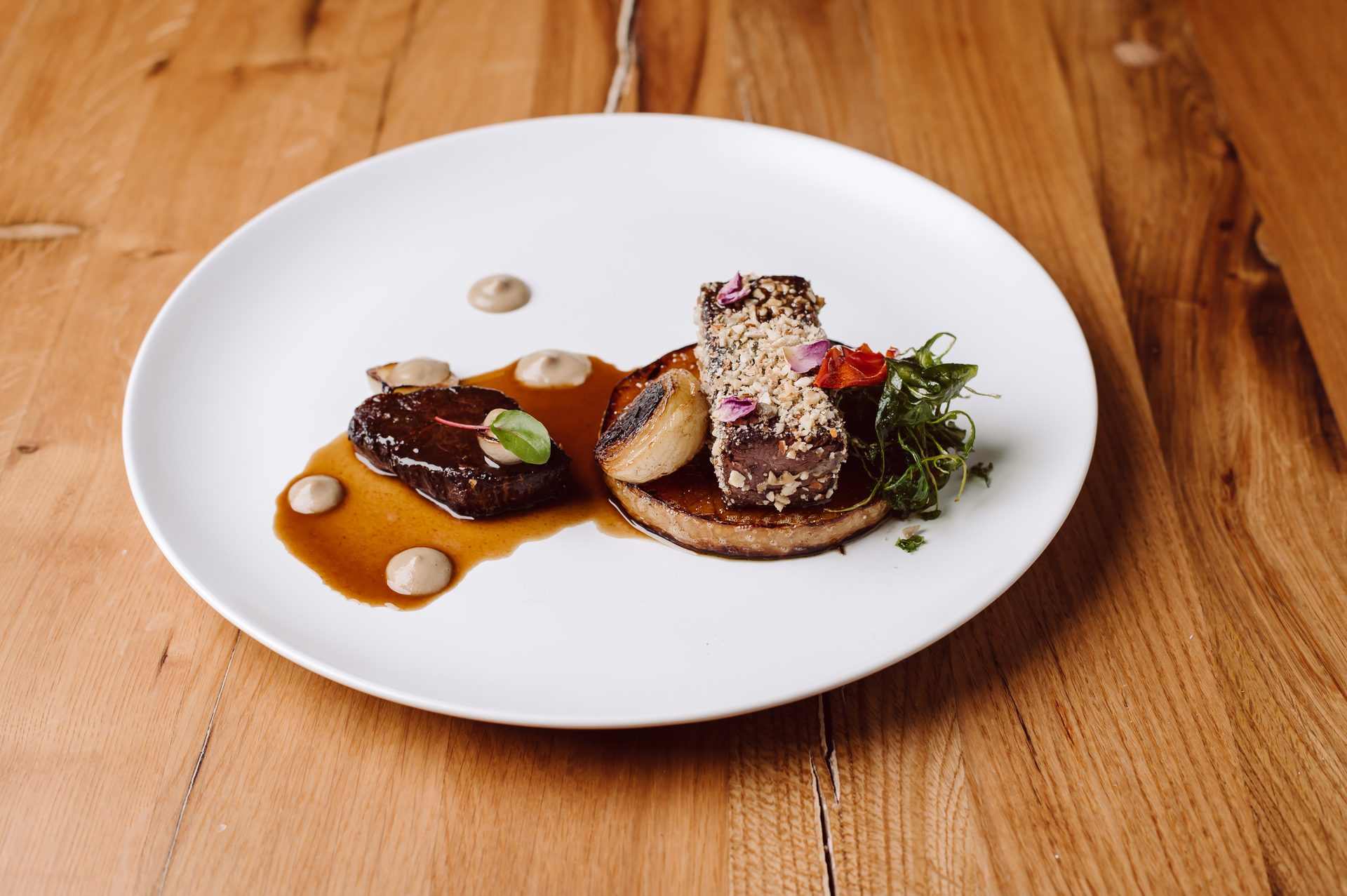 Plated fine dining main course at La Ursula — bistronomy presentation
