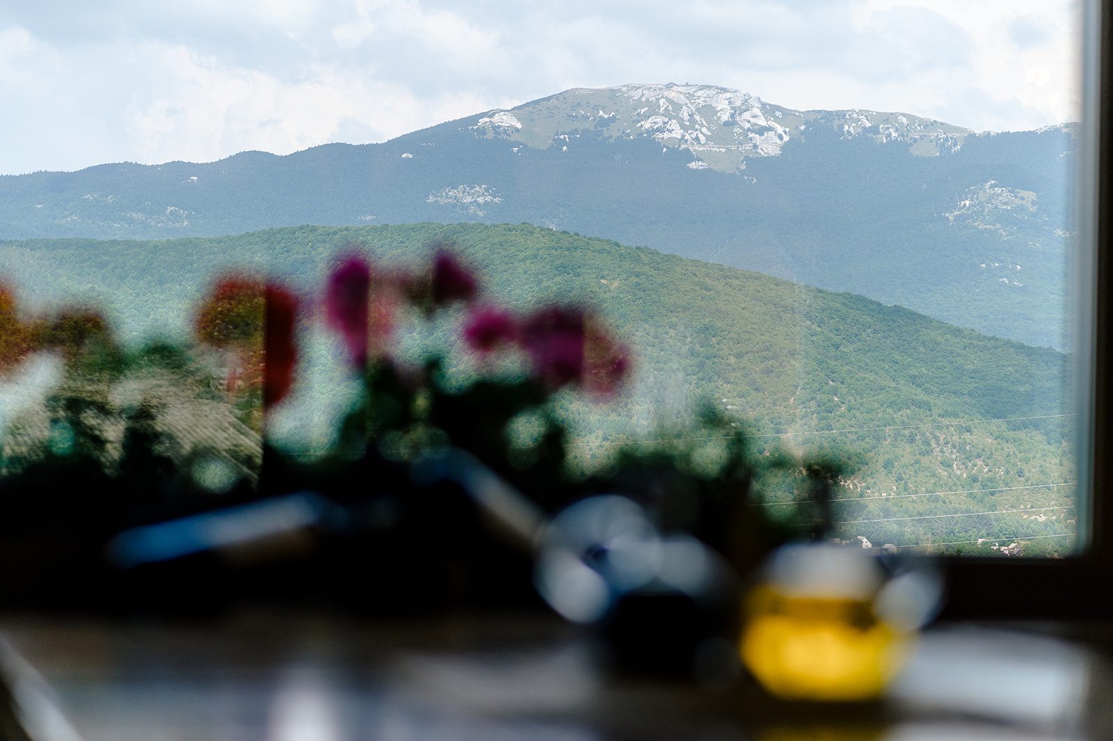 View of Mala Kapela mountain through La Ursula restaurant window