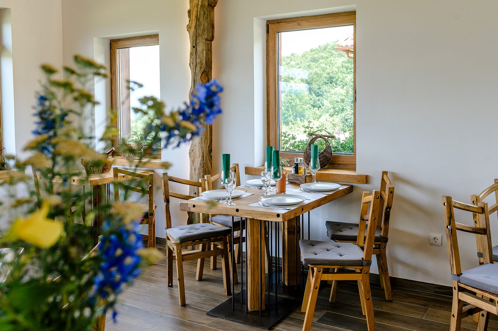 La Ursula dining room with wildflowers and mountain view through the window